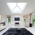 Modern living room with a roof lantern skylight, TV, and decorative elements.