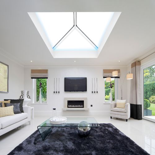 Modern living room with a roof lantern skylight, TV, and decorative elements.