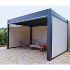 Outdoor pergola with red chairs and table on a gravel surface