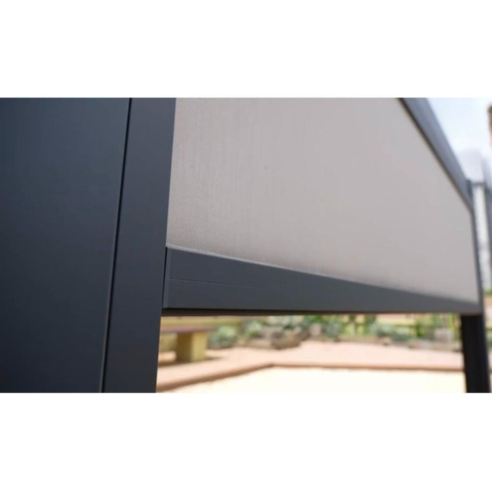 Close-up of a gray awning attached to a building with a blurred outdoor background.